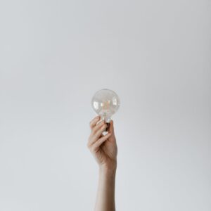 anonymous female showing light bulb